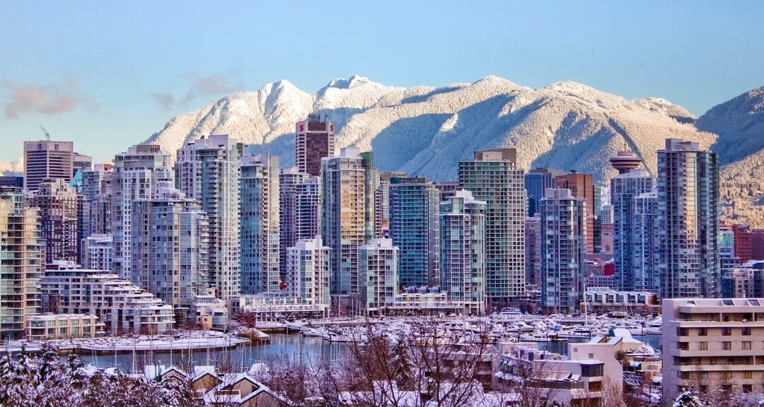 Downtown with snow on north shore mountains.