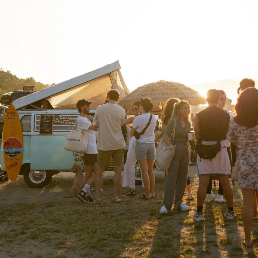 Crowd of people at vegan market on beach